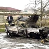 Hiện trường vụ đánh bom xe ở thành phố Kizlyar, nước Cộng hòa tự trị Dagestan thuộc Nga. (Ảnh: Reuters)