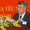 Tổng Giám đốc TTXVN Trần Mai Hưởng, đọc báo cáo về các phong trào thi đua yêu nước của TTXVN. (Ảnh: Doãn Tấn/TTXVN) 