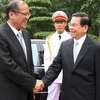 Chủ tịch nước Nguyễn Minh Triết đón Tổng thống Benigno S. Aquino III. (Ảnh: Nguyễn Khang/TTXVN)