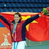 Niềm vui của võ sỹ Lê Bích Phương sau khi nhận huy chương vàng. (Ảnh: Quốc Khánh/TTXVN) 