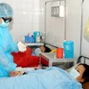Chăm sóc, điều trị cho bệnh nhân cúm A/H1N1 ở bệnh viện đa khoa Bắc Thăng Long. (Ảnh: Hữu Oai/TTXVN)