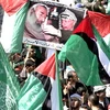 Người dân Palestine míttinh kêu gọi phong trào Fatah và Hamas hòa giải dân tộc. (Nguồn: Demotix)