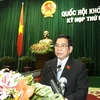 Chủ tịch nước Nguyễn Minh Triết trình bày Báo cáo công tác nhiệm kỳ 2007-2011 của Chủ tịch nước. (Ảnh: Nguyễn Dân/TTXVN)