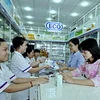 Bán thuốc tại một nhà thuốc chuẩn GPP ở Thành phố Hồ Chí Minh. (Ảnh: Thế Anh/TTXVN)