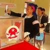 Cử tri người dân tộc thiểu số đi bỏ phiếu bầu cử Quốc hội và Hội đồng Nhân dân các cấp. (Ảnh: Nguyễn Công Hải/TTXVN)