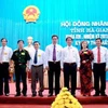 Các thành viên Ủy viên Ủy ban Nhân dân tỉnh Hà Giang khóa XVI, nhiệm kỳ 2011-2016 ra mắt tại kỳ họp. (Nguồn: báo Hà Giang)