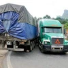 Hiện trường vụ va chạm xe container và xe rơmoóc trên đèo Gió. (Ảnh:Nguyễn Trình/Vietnam+)