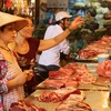 Giá thịt lợn tăng mạnh là nguyên nhân chủ yếu “đẩy” chỉ số CPI cả nước tháng 7 tăng tới 1,17% so với tháng Sáu. (Ảnh: Trần Việt/TTXVN)