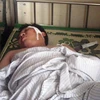Chiến sỹ công an Vũ Thái Sơn bị thương nặng nằm bệnh viện. (Nguồn: VTC.vn)