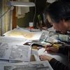 Họa sỹ truyện tranh Jiro Taniguchi trở lại giá vẽ truyện tranh sau 1 năm thảm họa kép. (Nguồn: AFP)