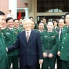 Tổng Bí thư Nguyễn Phú Trọng, Bí thư Quân ủy Trung ương với các đại biểu. (Ảnh: Trọng Đức/TTXVN)