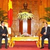 Phó Thủ tướng Nguyễn Xuân Phúc tiếp ông Nam Viyaketh, Bộ trưởng Bộ Công Thương Lào. (Ảnh: An Đăng/TTXVN)