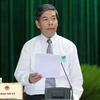 Bộ trưởng Bộ Tài nguyên và Môi trường Nguyễn Minh Quang trả lời chất vấn của đại biểu Quốc hội, sáng 13/6. (Ảnh: Nhan Sáng/TTXVN) 