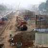 Thi công Đường vành đai 3 Hà Nội, một dự án hạ tầng trọng điểm của Thủ đô. (Nguồn: TTXVN)