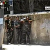 Lực lượng an ninh Syria trong cuộc xung đột tại Damascus ngày 18/7. (Nguồn: AFP/TTXVN)