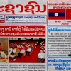 Báo của Lào đăng xã luận chào mừng 50 năm quan hệ ngoại giao Việt-Lào. (Ảnh: Hoàng Chương/Vietnam+)