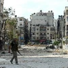 Tay súng nổi dậy tại quận Saif al-Dawla trong cuộc xung đột với quân Chính phủ ở thành phố miền Bắc Aleppo ngày 9/10. (Nguồn: AFP/TTXVN)