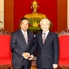 Tổng Bí thư Nguyễn Phú Trọng tiếp Trưởng Ban Tổ chức Trung ương Đảng Nhân dân Cách mạng Lào, Chansy Phosikham. (Ảnh: Trí Dũng/TTXVN)