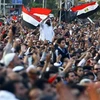 Người Ai Cập biểu tình phản đối phản đối sắc lệnh mới của Tổng thống Mohamed Morsi về hiến pháp. (Nguồn: THX/TTXVN)