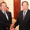 Tổng Bí thư, Chủ tịch nước Lào Chummaly Saynhasone tiếp Bí thư Trung ương Đảng, Chánh án Tòa án ND tối cao Trương Hòa Bình. (Ảnh: Hoàng Chương/TTXVN)