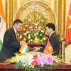 Thứ trưởng Bộ Ngoại giao Việt Nam Hồ Xuân Sơn và Đại sứ đặc mệnh toàn quyền Ấn Độ tại Việt Nam, ngài Ranjit Rae tại lễ ký. (Ảnh: Dương Giang/TTXVN)