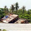 Hiện trường một vụ chìm tàu du lịch trên sông Sài Gòn tháng 5/2013. (Ảnh: Mạnh Linh/TTXVN)