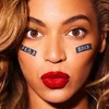 Gương mặt Beyonce với hai bên má ghi ngày tổ chức trận đấu. (Nguồn: beyonce.com)