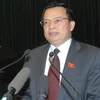 Bộ trưởng Bộ Nội vụ Trần Văn Tuấn trả lời chất vấn của đại biểu Quốc hội. (Ảnh: Nhan Sáng/TTXVN)