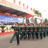 Diễu binh, diễu hành trong lễ kỷ niệm. (Ảnh: Sỹ Huynh/TTXVN)