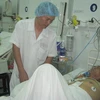 Bệnh nhân Việt đã tỉnh và phục hồi tốt sau khi phẫu thuật. (Ảnh: Thanh Sang/Vietnam+)