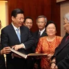 Phó Chủ tịch Trung Quốc Tập Cận Bình trong chuyến thăm Lào. (Ảnh: Xinhua)