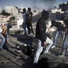 Những người Palestine trong một cuộc xung đột. (Ảnh: AFP/TTXVN)