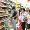 Người dân mua hàng tại siêu thị Big C. (Ảnh: Trần Việt/TTXVN)