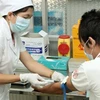 Xét nghiệm máu miễn phí cho người dân tại trung tâm phòng chống HIV/AIDS. (Ảnh: Dương Ngọc/TTXVN)