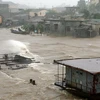 Thị trấn Thuận An huyện Phú Vang (Huế) chìm trong nước do ảnh hưởng bão số 9. (Ảnh: Xuân Trường/TTXVN)