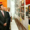 Ông Trương Tấn Sang, Ủy viên Bộ Chính trị, Thường trực Ban Bí thư thăm Phòng Truyền thống Ban Đối ngoại Trung ương. (Ảnh:Thống Nhất/TTXVN)
