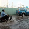 Triều cường gây ngập ở Thành phố Hồ Chí Minh. (Ảnh: Kim Phương/TTXVN)
