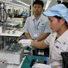Dây chuyền sản xuất tại Nhà máy sản xuất điện thoại di động Samsung Việt Nam. (Ảnh: Đức Tám/TTXVN)