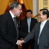 Chủ tịch nước Nguyễn Minh Triết tiếp Đoàn đại biểu thành phố Bern do Thị trưởng Alexander Tschappat dẫn đầu. (Ảnh: Nguyễn Khang/TTXVN)