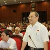 Đại biểu Quốc hội tỉnh Thanh Hóa Lê Văn Cuông chất vấn thành viên Chính phủ. (Ảnh: Doãn Tấn/TTXVN)