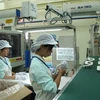 Hoạt động của Công ty Key Plastics Việt Nam, doanh nghiệp 100% vốn đầu tư Nhật Bản. (Ảnh: Dương Chí Tưởng/TTXVN)