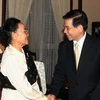 Chủ tịch nước Nguyễn Minh Triết tiếp bà Thongvin Phomvihane. (Ảnh: Nguyễn Khang/TTXVN)