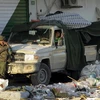 Quân Chính phủ bảo vệ an ninh tại một tòa nhà ở Misrata ngày 8/4. (Nguồn: AFP/TTXVN)