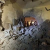 Tòa nhà của nhà lãnh đạo Lybia Muammar Gaddafi ở Tripoli bị phá hủy sau cuộc không kích của NATO ngày 30/4. (Nguồn: AFP/TTXVN)