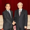 Tổng Bí thư, Chủ tịch Quốc hội Nguyễn Phú Trọng hội kiến với Thủ tướng Chính phủ Lào Thongsing Thammavon. (Ảnh: Trí Dũng/TTXVN)