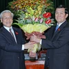 Tổng Bí thư Nguyễn Phú Trọng chúc mừng Chủ tịch nước Trương Tấn Sang. (Ảnh: Nhan Sáng/TTXVN)