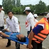 Diễn tập cứu hộ, cứu nạn phòng, chống lụt bão tại Hậu Giang. (Ảnh: Duy Khương/TTXVN)