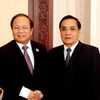 Thủ tướng Lào tiếp Bộ trưởng Hoàng Tuấn Anh. (Ảnh: Hoàng Chương/Vietnam+)