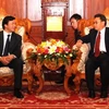 Phó Chủ tịch Quốc hội Lào tiếp Chủ nhiệm Văn phòng Quốc hội Nguyễn Hạnh Phúc. (Ảnh: Hoàng Chương/Vietnam+)
