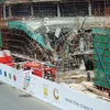 :Hiện trường sự cố sập công trình xây trung tâm thương mại ở Phú Mỹ Hưng. (Ảnh: Thế Vinh/TTXVN)